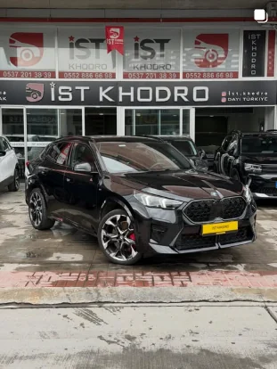 Black BMW X2 in front of the İST KHODRO showroom